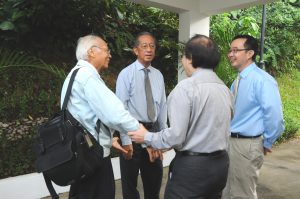 Sharing a warm moment: (From left) Former Scientific Advisory Board member LUI Pao Chuen, Bernard TAN, Louis CHEN (back facing camera) and Deputy Director TAN Ser Peow
